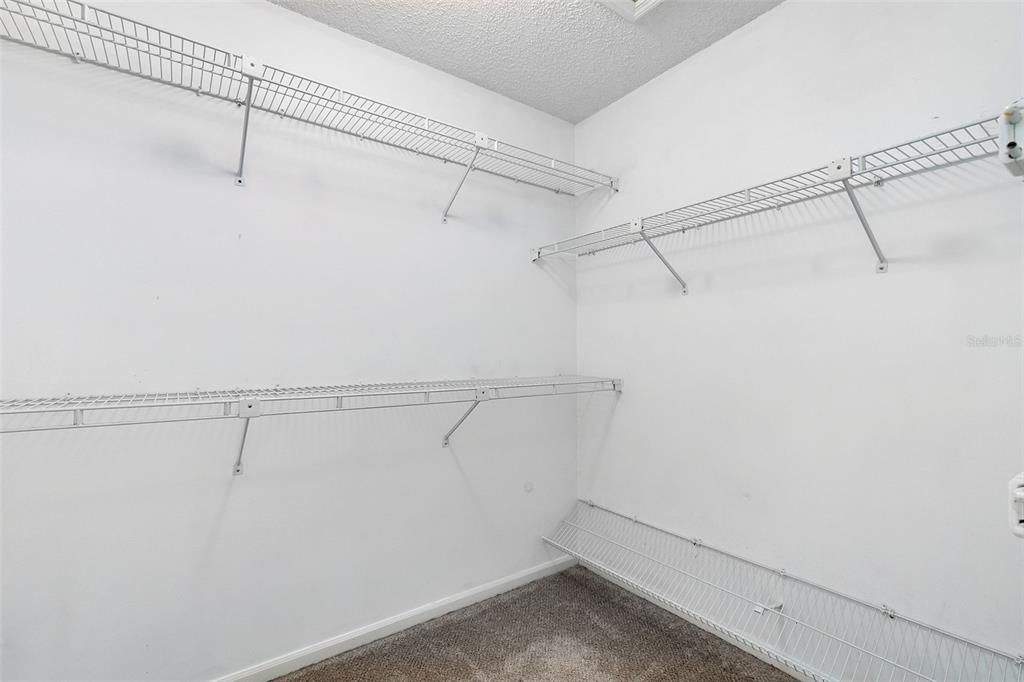 A walk-in closet in the master has ample room for clothing, shoes and accessories.