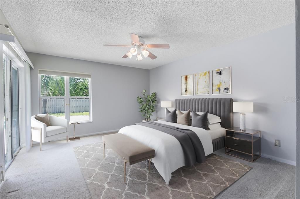 This photo has been virtually staged. Retreat to the master bedroom, conveniently located off the living and dining area, where private pool access and a walk-in closet await.