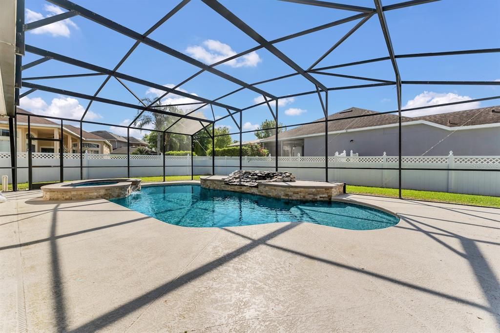 The enormous outdoor space makes this home an entertainer's dream with multiple seat areas and a SOLAR HEATED WATER POOL all SCREENED for your comfort!