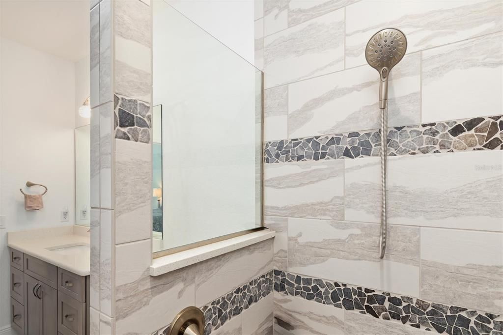 Savor in the soothing comfort of your rain-head shower as you contemplate your day.