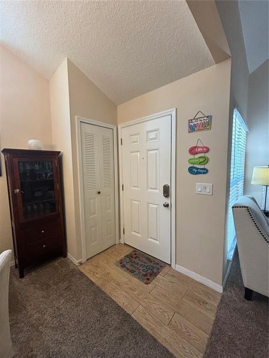 Kitchen features Closet Pantry and Laundry Closet with Stackable Washer & Dryer