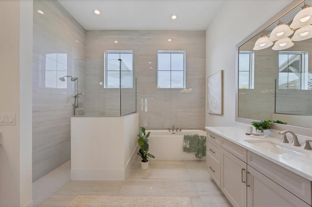 Primary Bath - Walk-in shower and freestanding tub; porcelain tile to ceiling