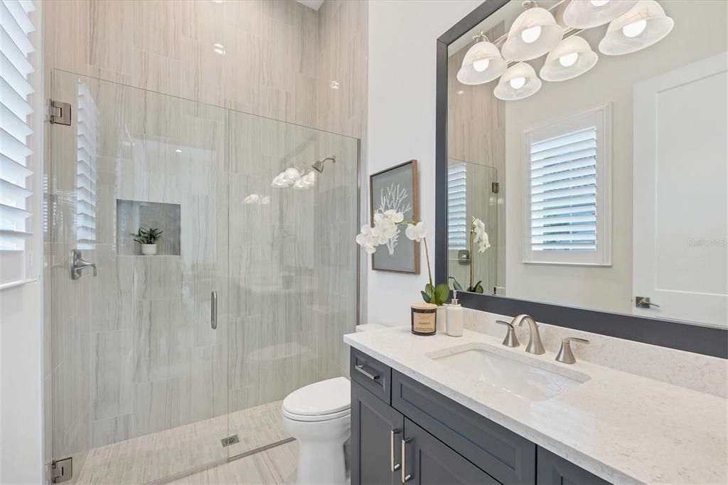 Bath 5 - en suite Casita bathroom with Quartz countertop, Toto toilet and walk-in shower