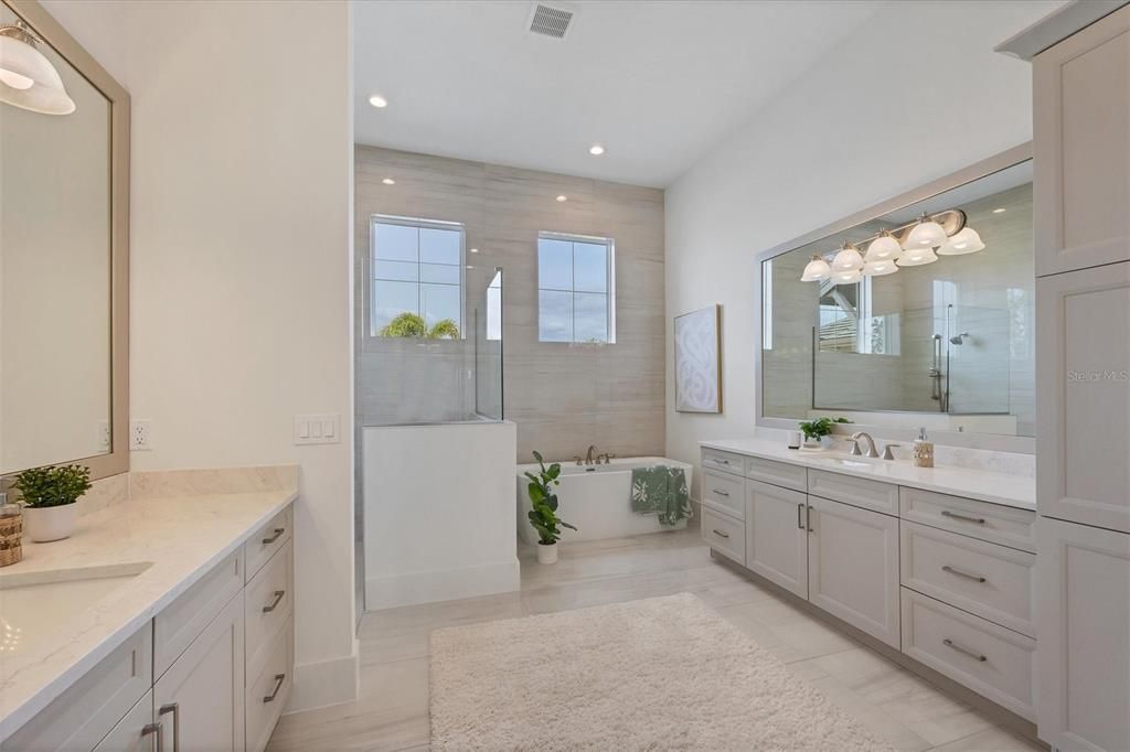 Primary en suite Bath - quartz counters, marble tile, dual vanities, walk-in shower, freestanding tub