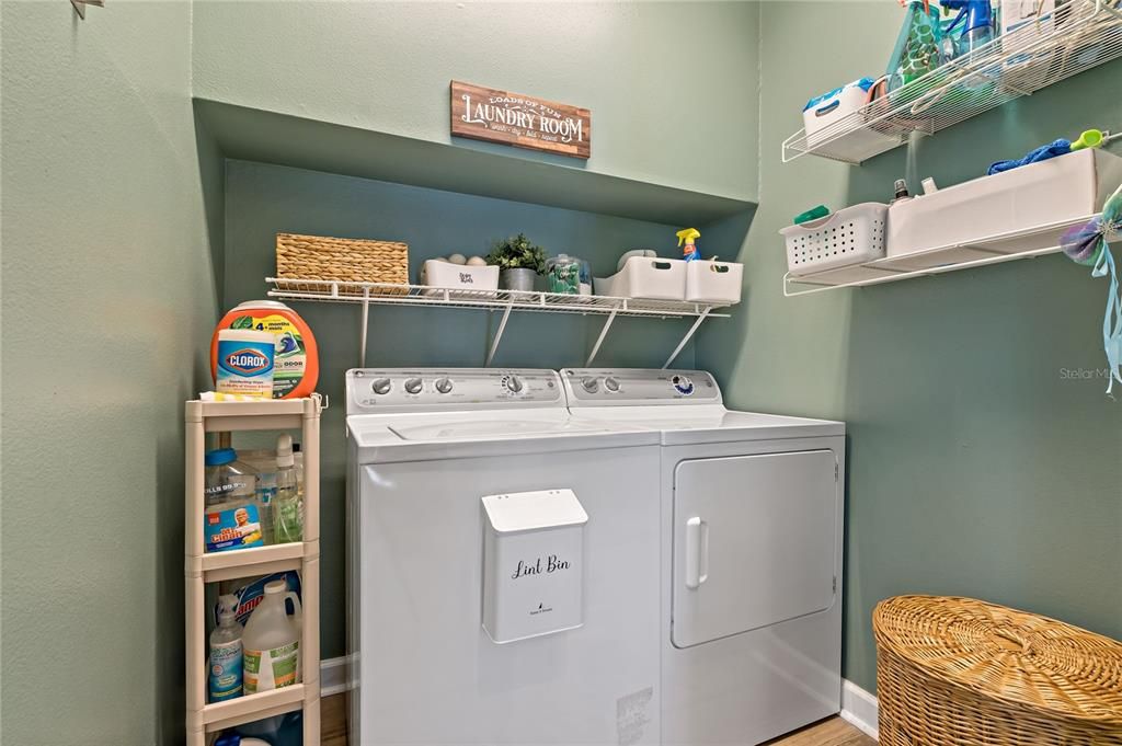 LAUNDRY ROOM WITH SHELVES TO PROVIDE EXTRA STORAGE!