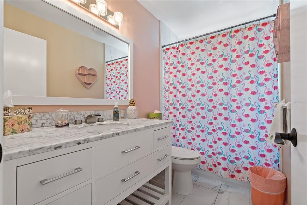 SPACIOUS VANITY IN GUEST BATHROOM WITH TUB AND SHOWER COMBO!
