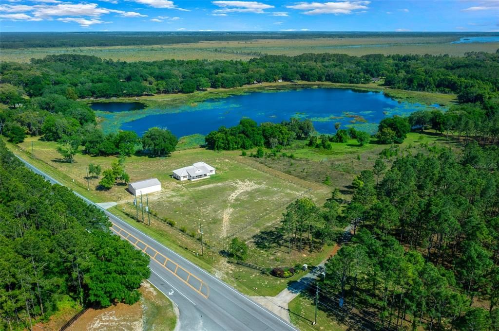 Drone photo depicting property lay out with lake