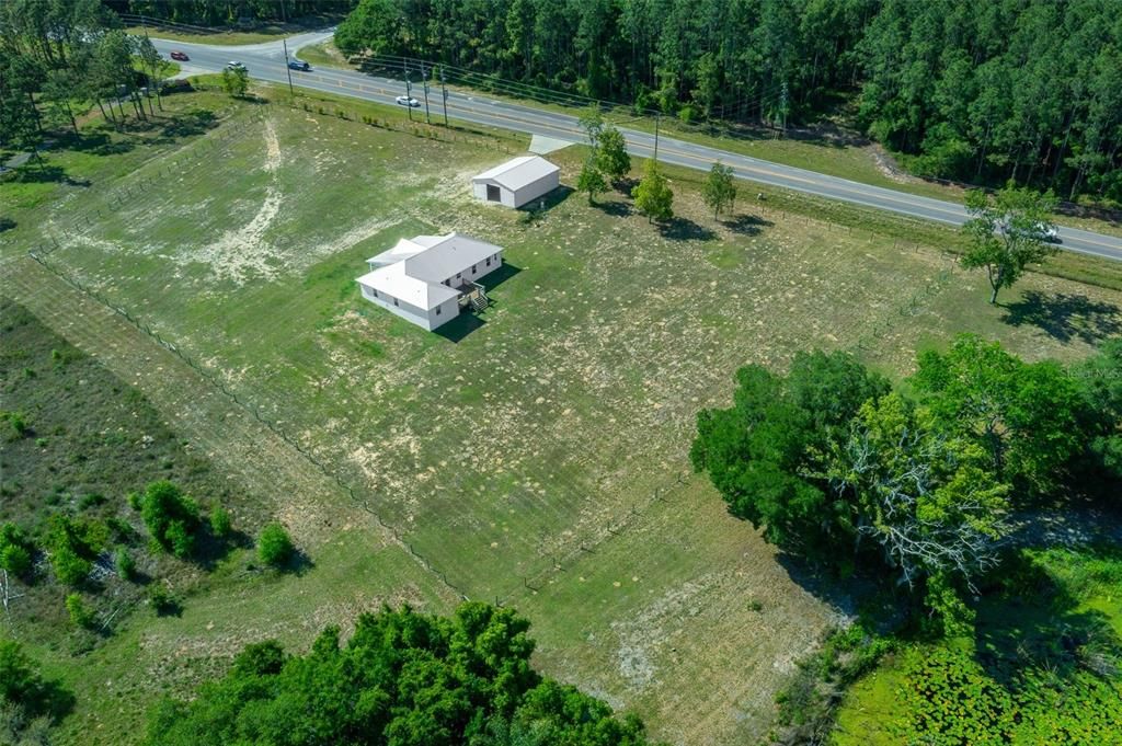 Drone shot depicting 2.5 fenced acres