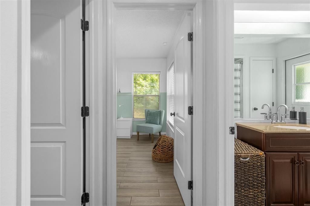 Hall bath and view toward bedroom 3