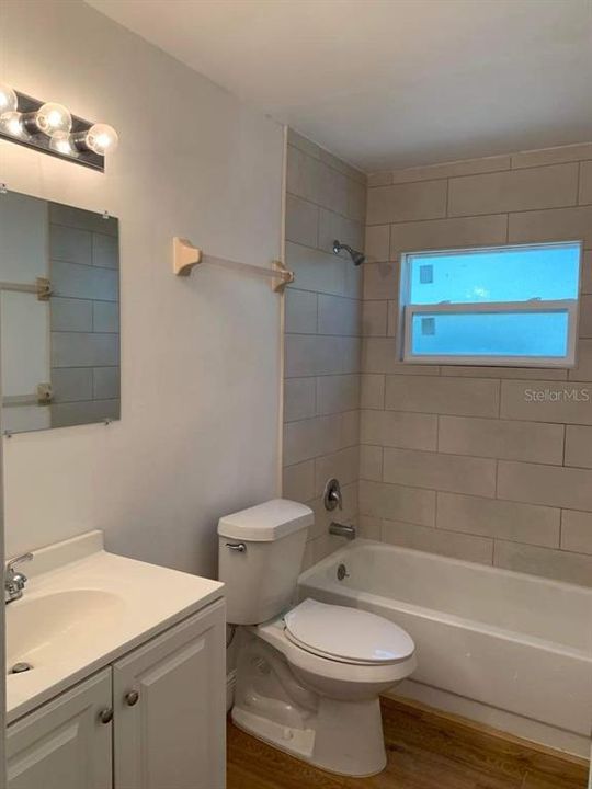 Updated bathroom with tub