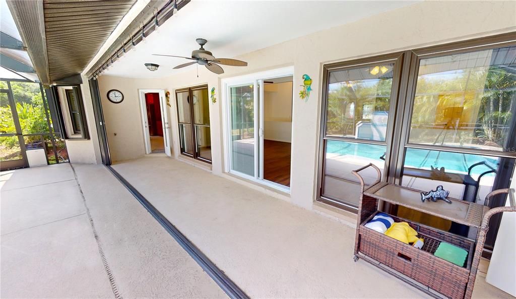 Screened pool enclosure and under-roof area