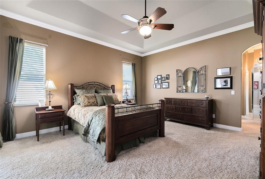 Into the master bedroom complete with tray ceiling, crown molding & an en-suite bathroom, featuring 2 huge walk in closets, separate sinks, jacuzzi tub & updated seamless separate shower.