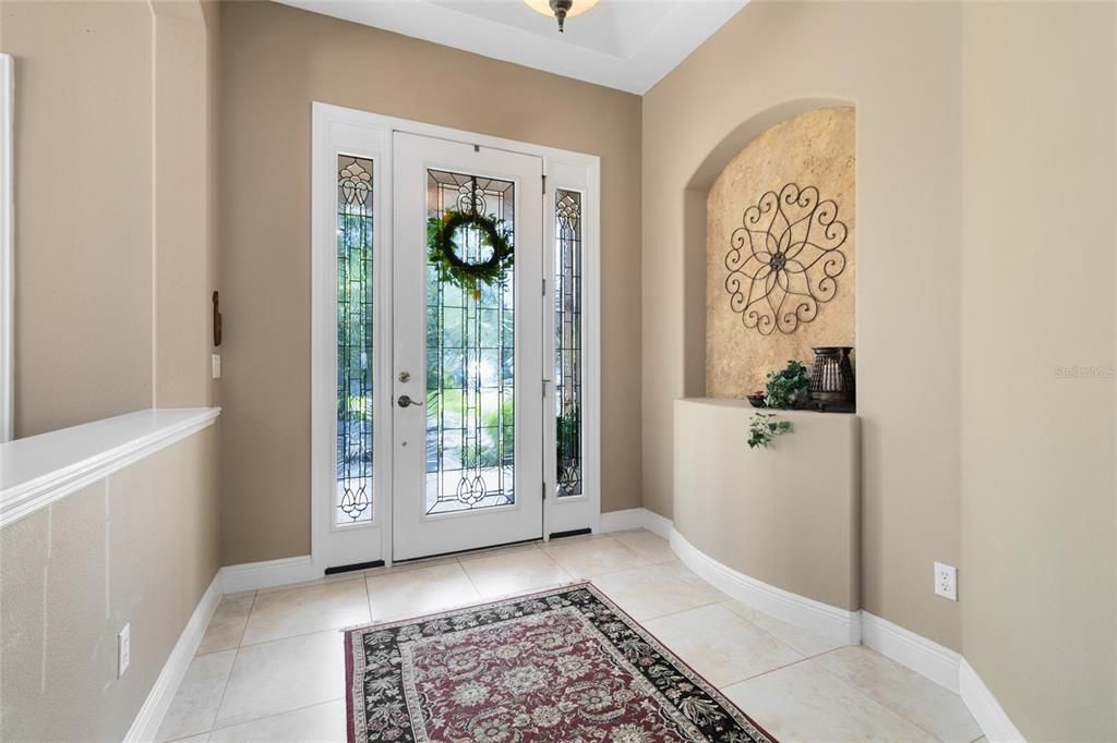 Upon entering, you are welcomed by a grand open foyer.