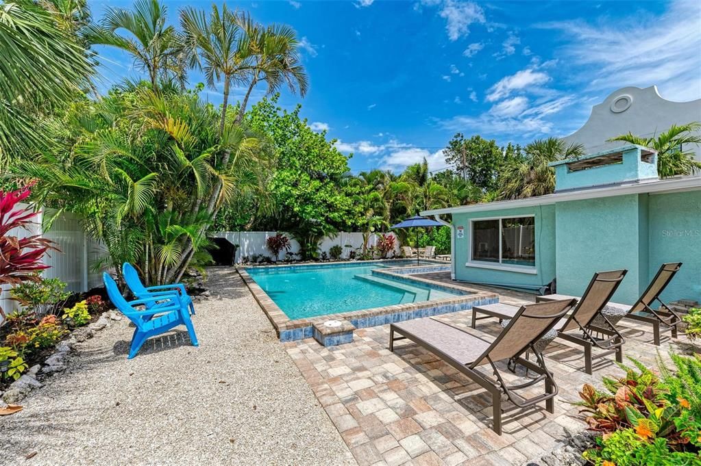 Spectacular Deck overlooks the lushly landscaped back yard and pool. A true tropical oasis.