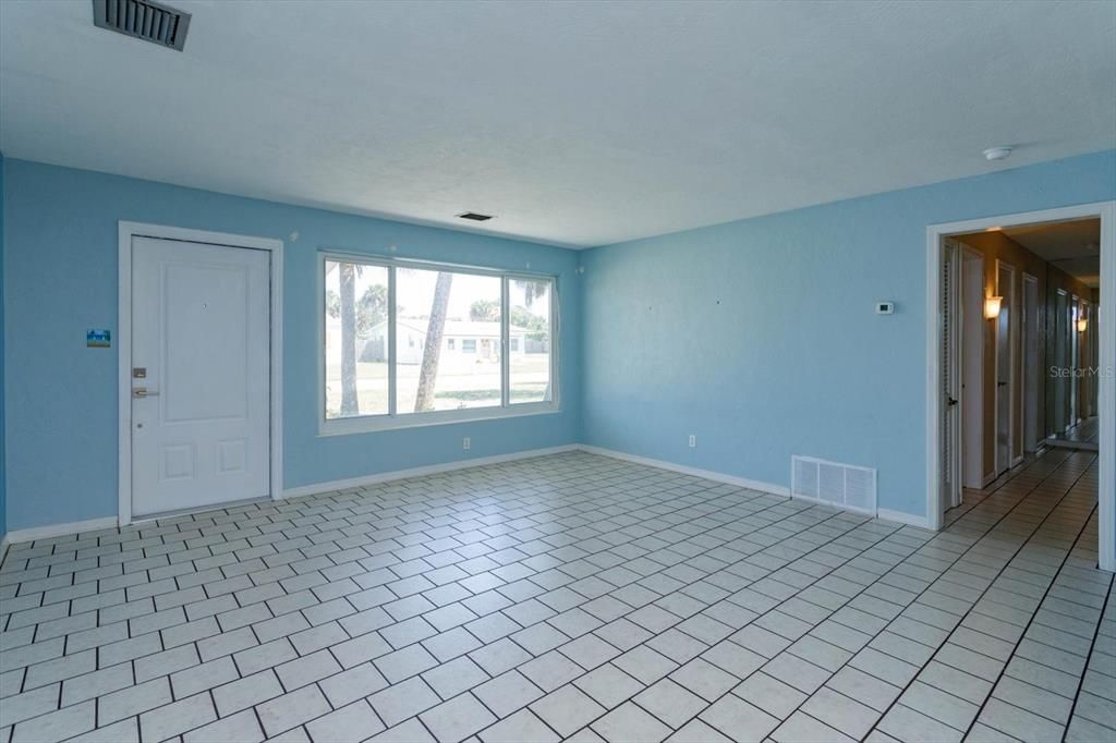 Living room is 16 x 16 with tile floors