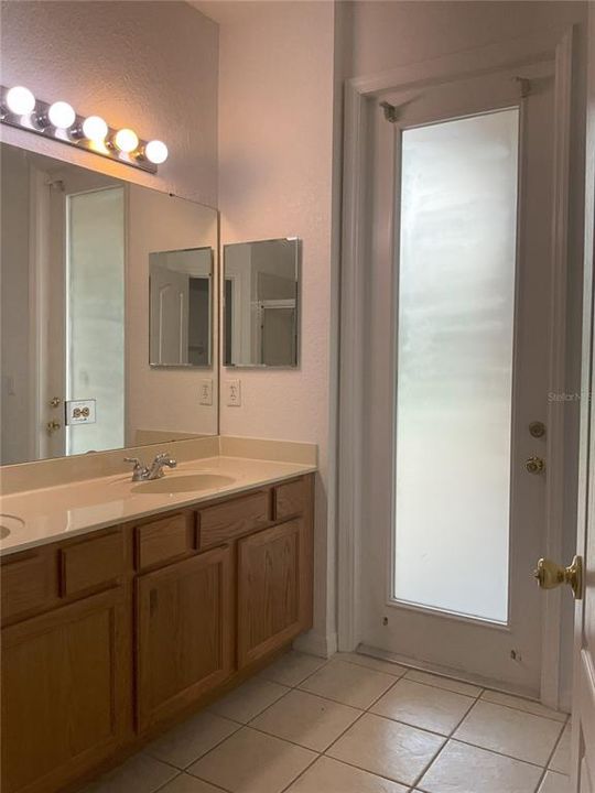 Master bathroom with door to the patio/pool