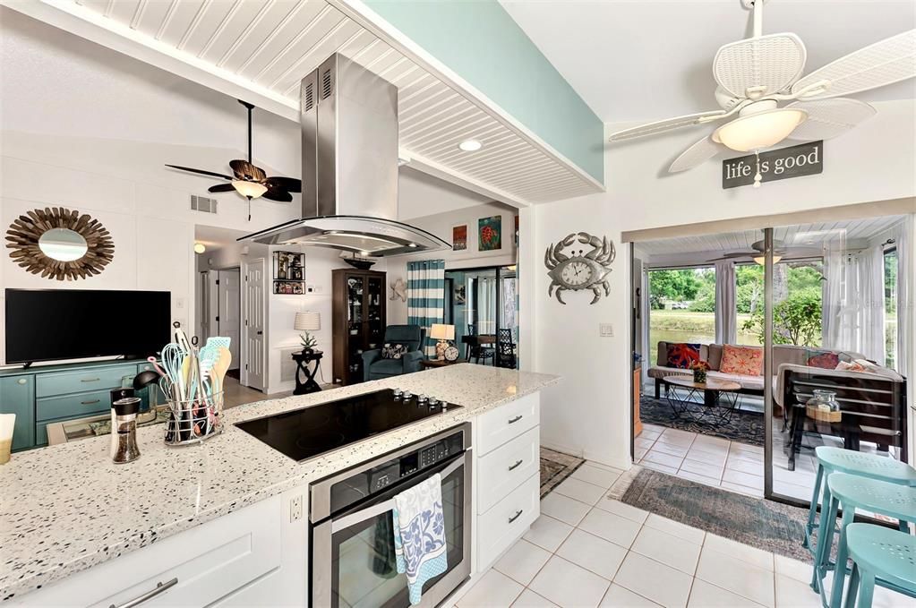 Open Kitchen with Stainless Hood/Fan, Cooktop & Over
