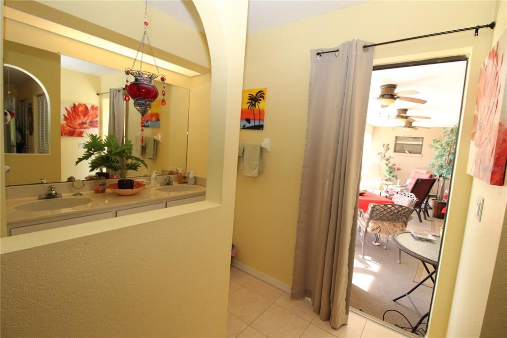 Primary Bedroom with mini sliding glass doors out to your lanai/pool area...