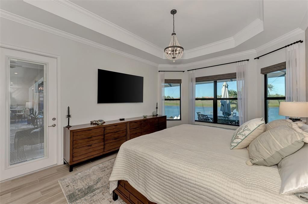 The Master Bedroom has Access to the lanai, pool, spa