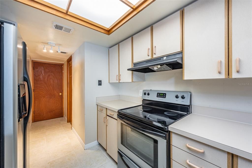 Convenience is key on the first floor, with a discreet half bath, under-stair pantry, and access to an oversized one-car garage with laundry. All kitchen appliances convey to buyer.