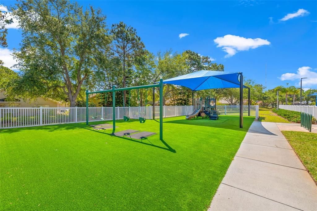 Fenced-in Playground adjacent to the Key Vista Clubhouse offers plenty of shade for little ones to enjoy!