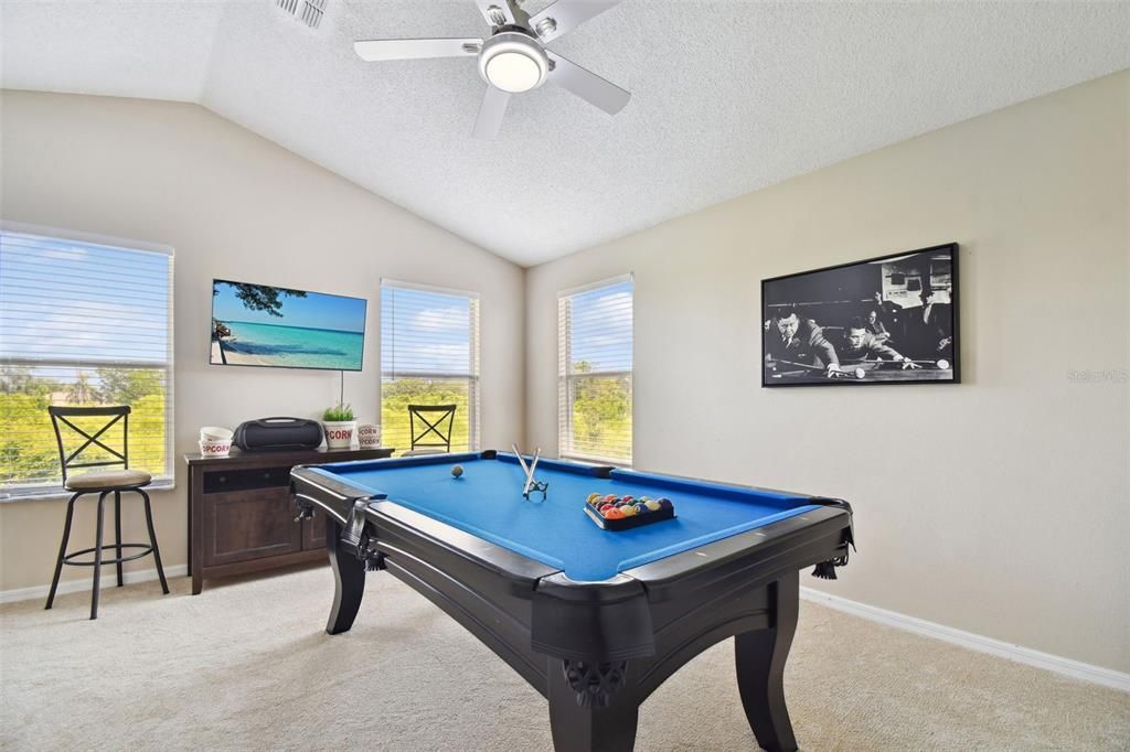 4th Bedroom located upstairs is currently used as a Game Room with gorgeous views of the nature preserve