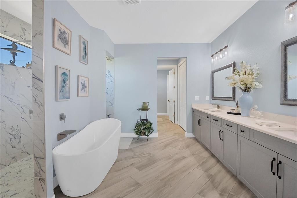 Main Bathroom with beautiful soaking tub and walk through shower