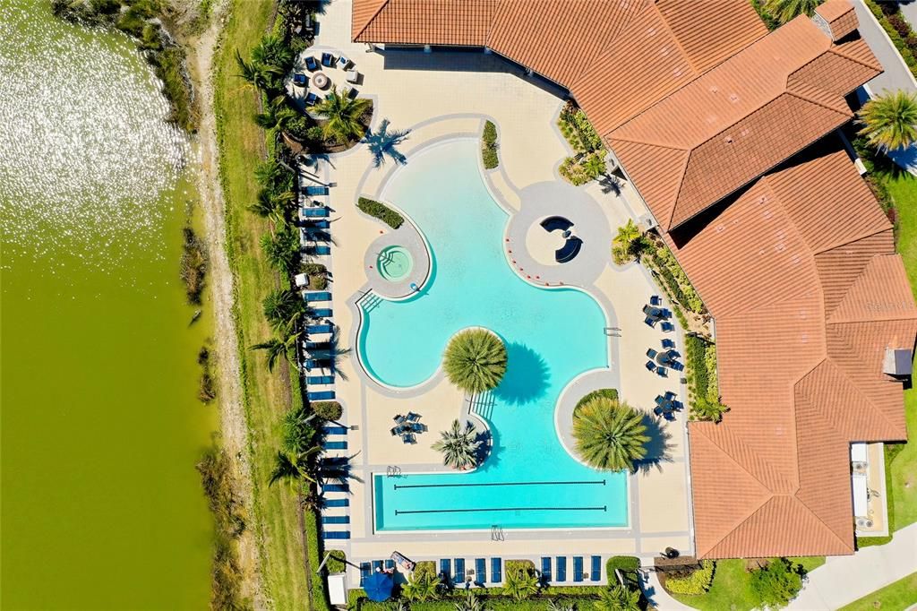 Huge Community pool with beach walk-in and lap area.
