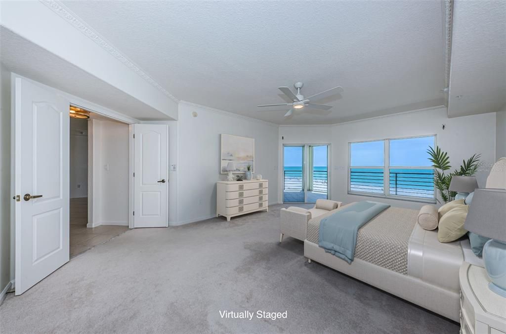 Virtually staged. Primary Bedroom with beautiful Gulf front views.