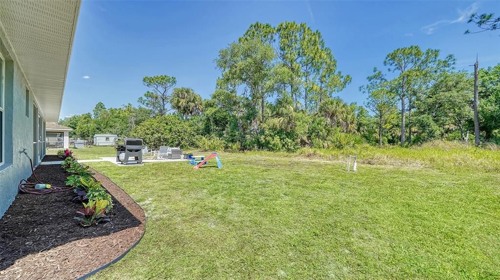 The backyard is large with a pristine county owned lot behind.