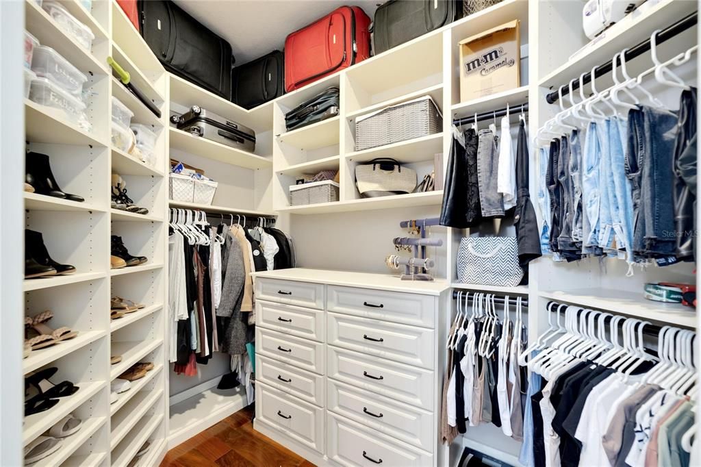 Large 'Her' walk-in Closet with custom shelving