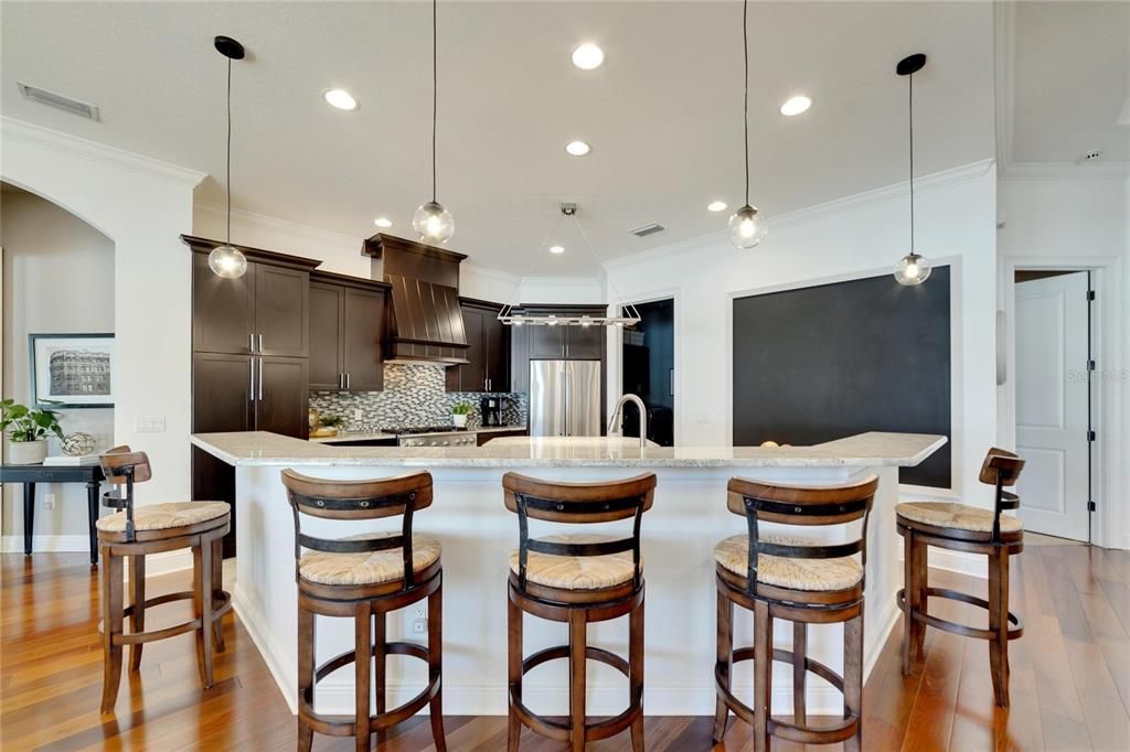 kitchen includes a sectioned off wall with chalkboard paint