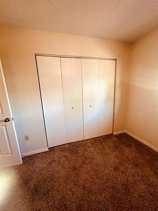 GUEST BEDROOM WITH BUILT IN CLOSET