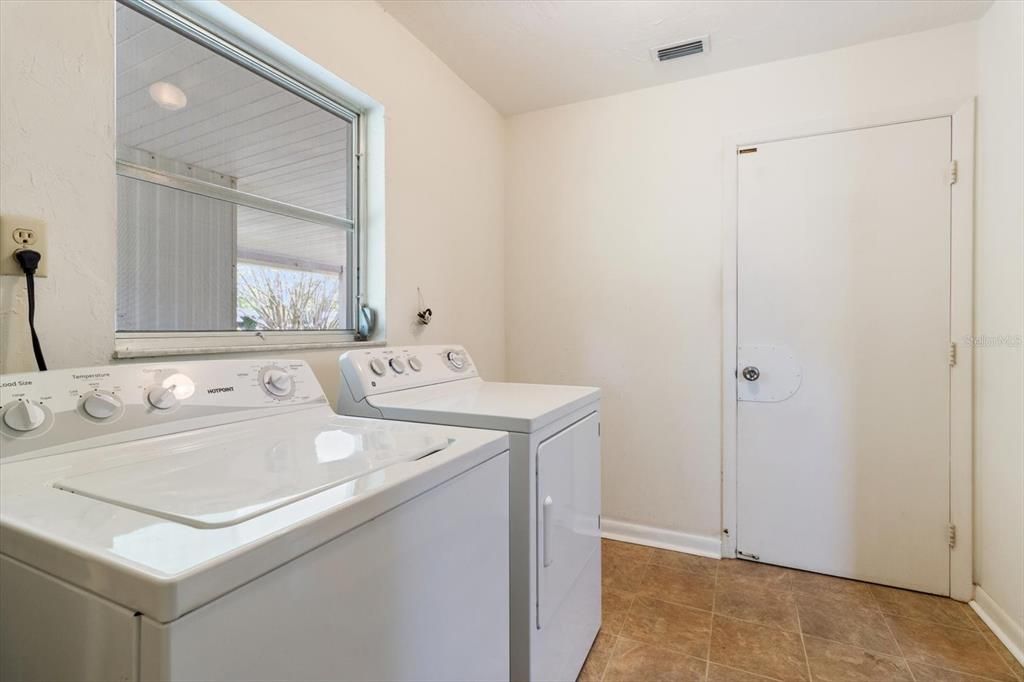 Laundry Room with Door Leading to Garage