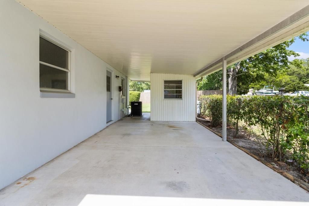Attached Carport has a Small, Enclosed Utility Room