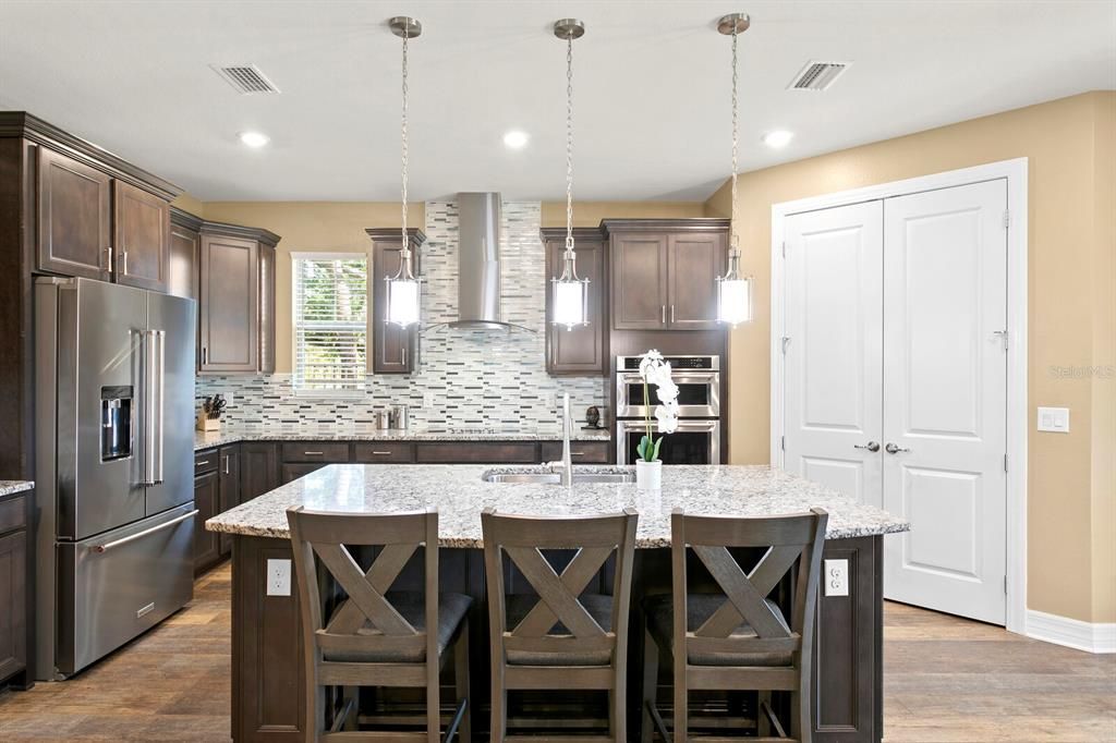 You'll find an oversized island with pendant lighting and spacious breakfast bar