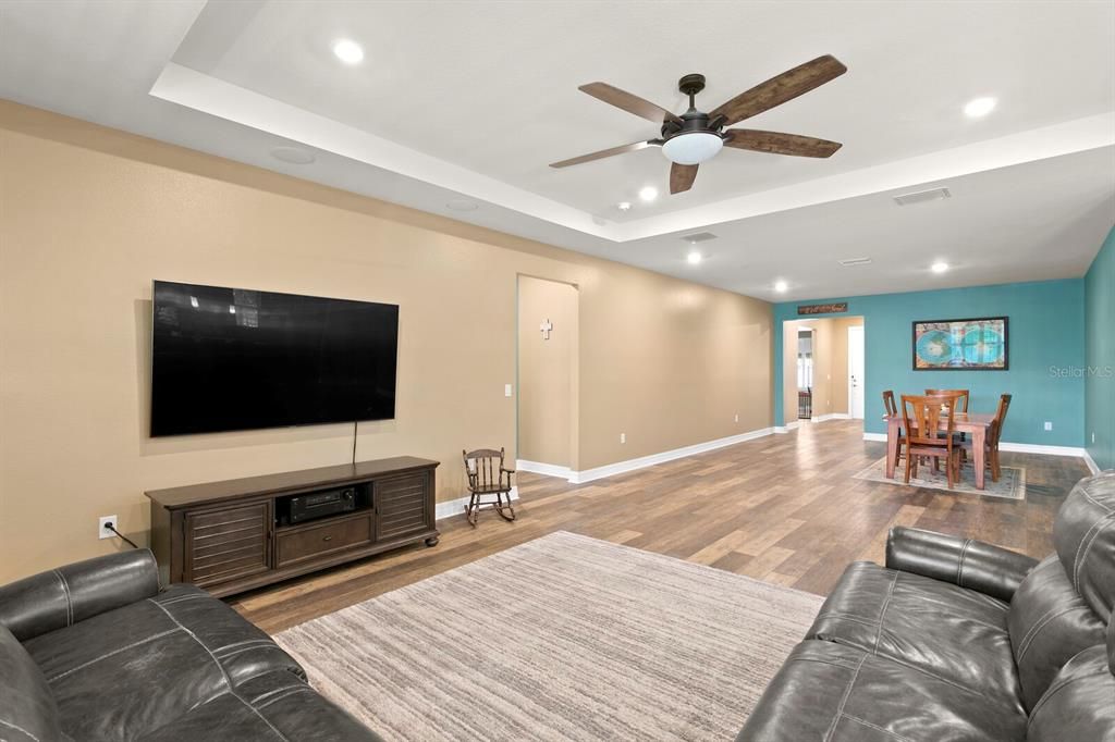 The family room features a tray ceiling