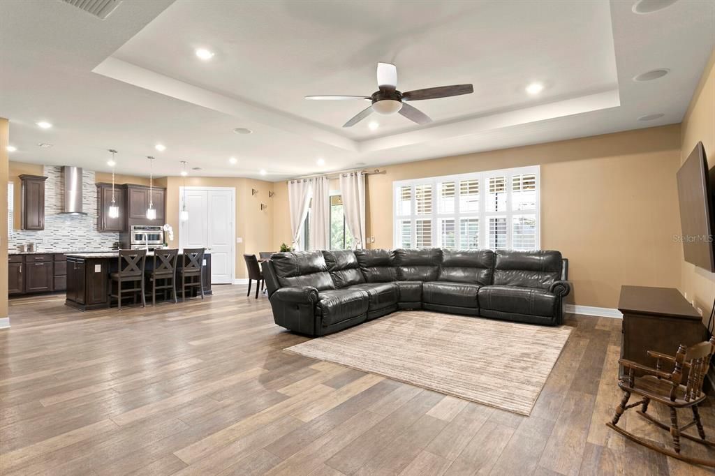 Head back out of the master suite to the family room and kitchen beyond