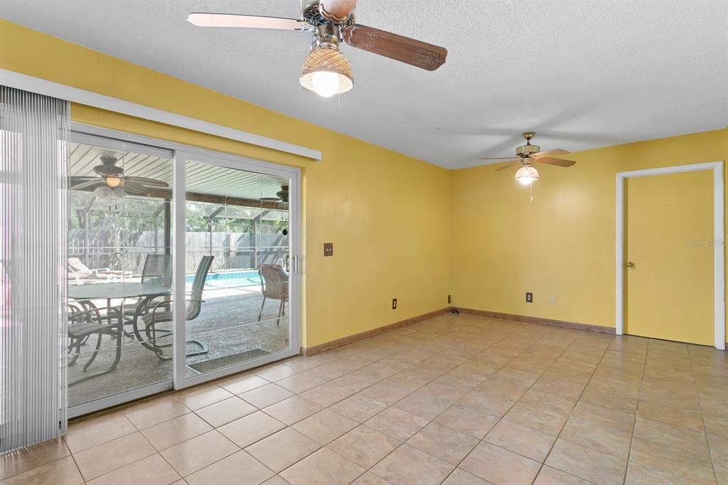 Sliding doors in the family room lead out to the screend lanai and huge pool