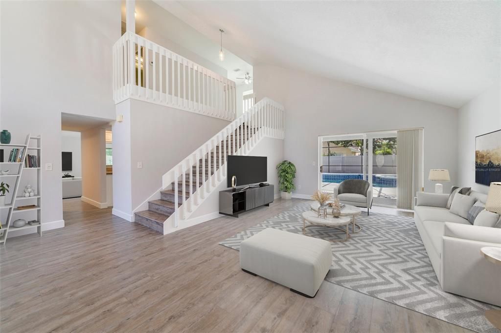 The cheerful front front door welcomes you home and invites you to step into spacious and flexible formal living and dining areas complemented by the LUXURY VINYL PLANK WOOD FLOORS (2022) that run throughout the main floor and HIGH CEILINGS. Virtually Staged.