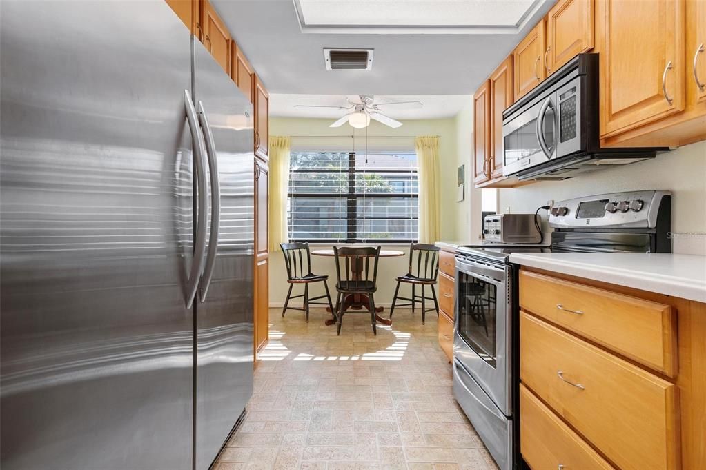 Kitchen with full size freezer and refrigerator