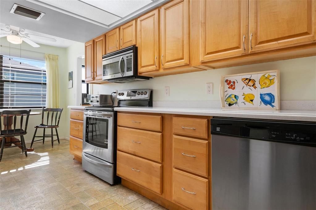 Kitchen with maple cabinets and Corian counters