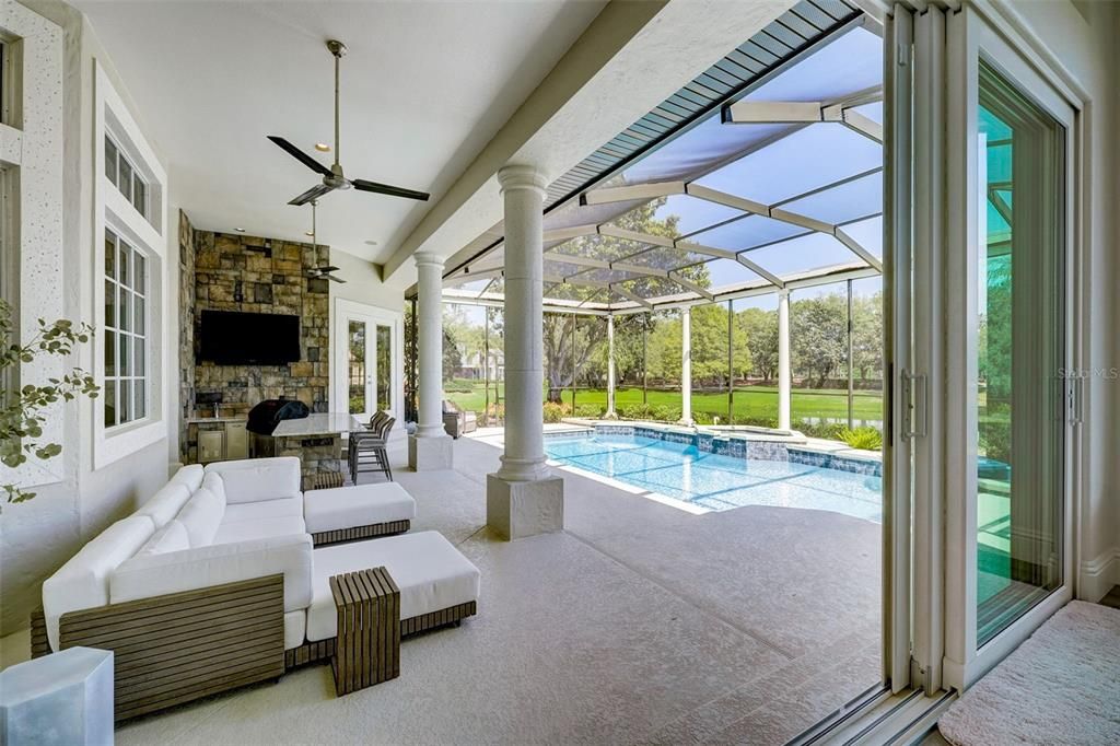 The expansive lot is perfectly situated on an exclusive cul-de-sac to enhance the outdoor space - relax on the covered lanai, cookout in the Summer kitchen or spend the day in your heated pool and spa - all screened for maximum comfort with optimum privacy!