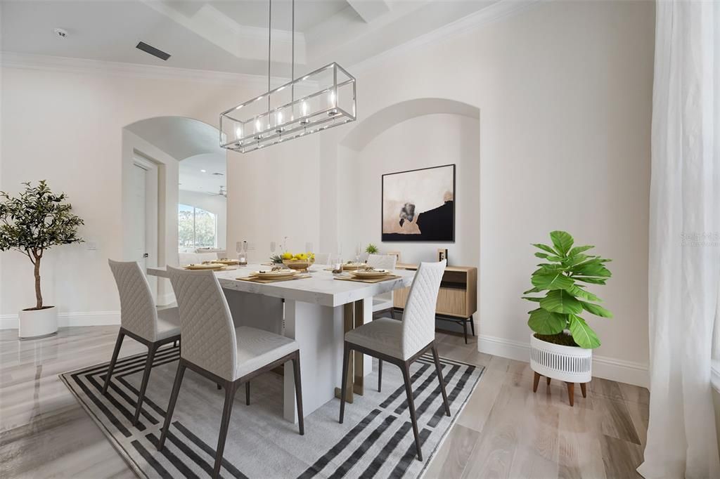 Formal living and dining rooms allow you to gather with family and entertain guests with ease, the chic modern light fixtures compliment the polished tile floors and fresh neutral color palette! Virtually Staged.