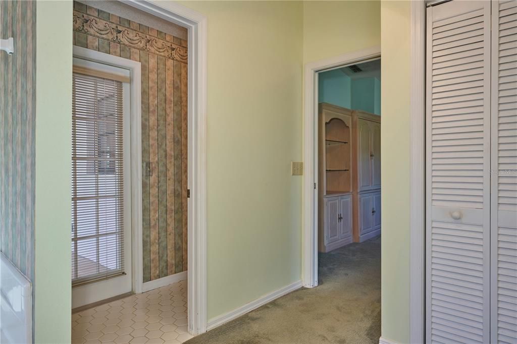 The glass door leads out to the Florida room from the water closet