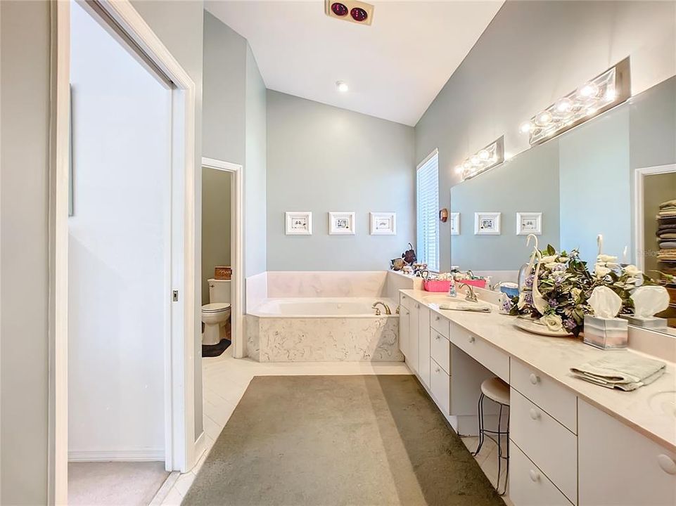 2 basin sink & Jacuzzi Garden Tub in Primary Bathroom.