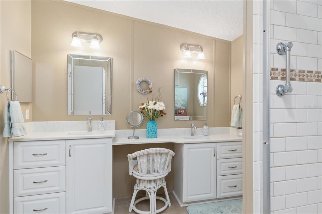 Double sinks in primary bathroom and walk-in shower.