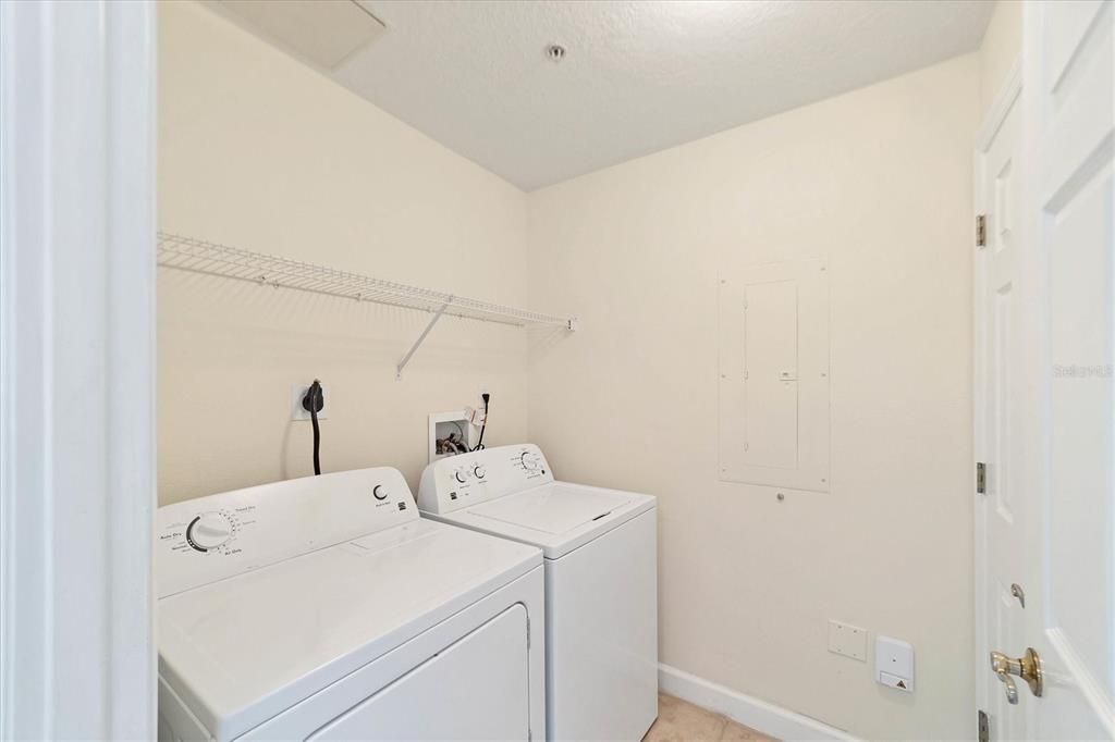Laundry room with built-in storage closet