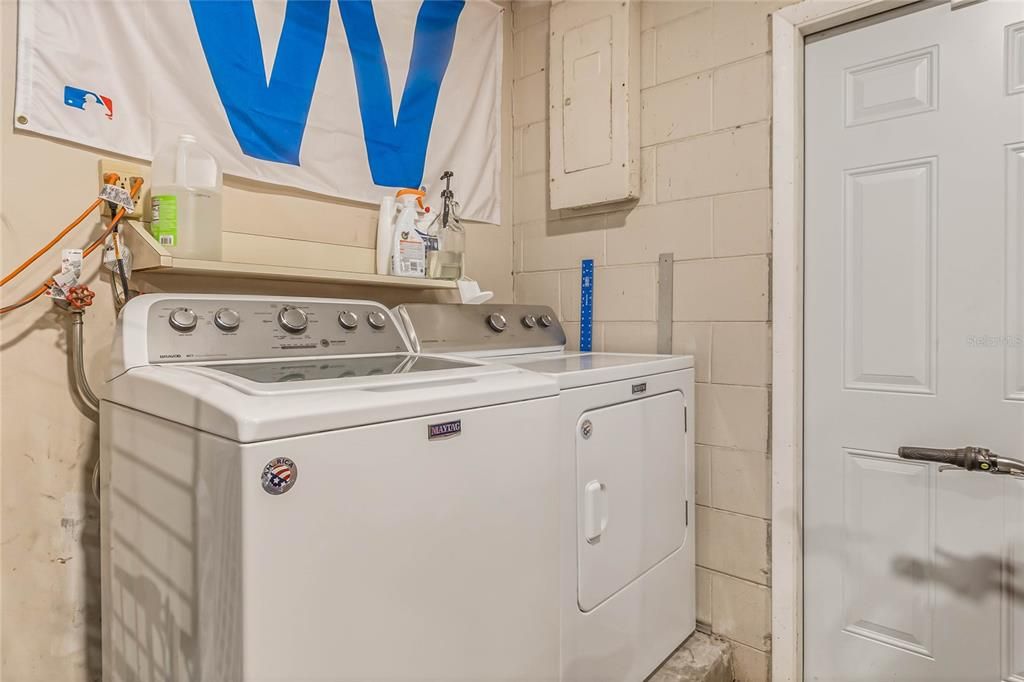 Laundry is located in garage with a side door to the outside.