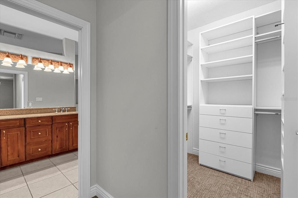 Two custom closets in primary suite